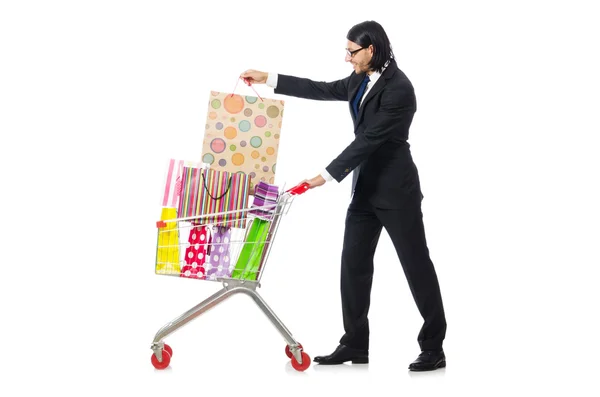 Uomo shopping con carrello supermercato isolato su bianco — Foto Stock