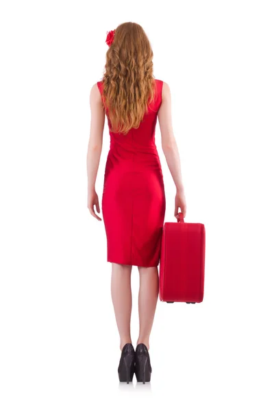 Kadın kırmızı elbise ve seyahat çantası — Stok fotoğraf