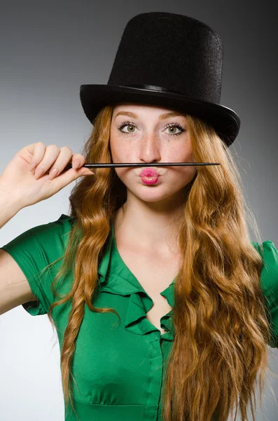 Woman magician wearing green dress — Stock Photo, Image