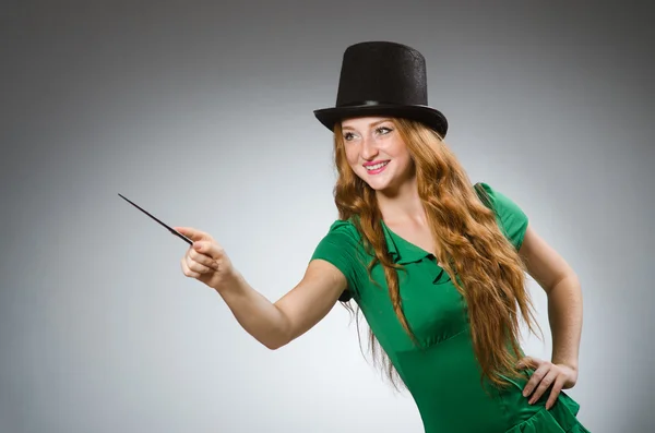 Woman magician wearing green dress — Stock Photo, Image