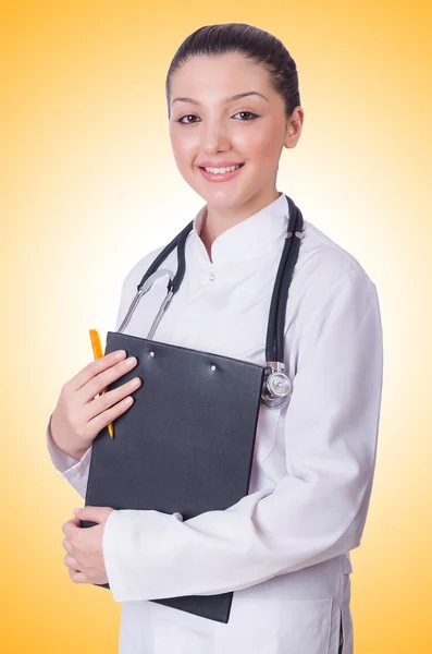 Young woman doctor on orange Stock Image