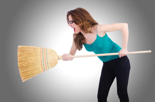 Young woman with broom — Stock Photo, Image