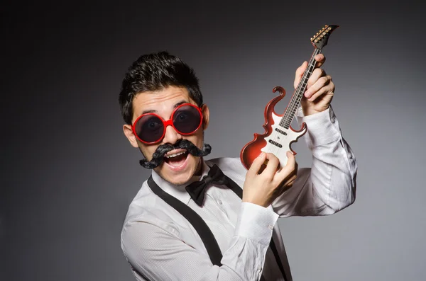 Funny man with mini guitar — Stock Photo, Image