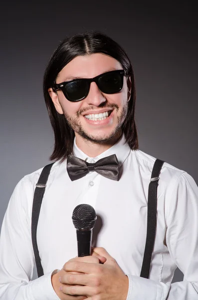 Funny singer with microphone at the concert — Stock Photo, Image