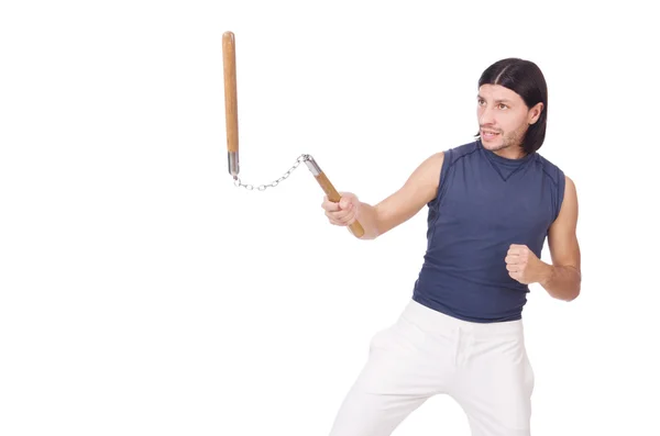 Divertido luchador de karate con nunchucks en blanco — Foto de Stock