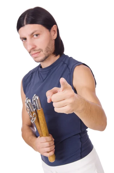 Divertido luchador de karate con nunchucks en blanco — Foto de Stock