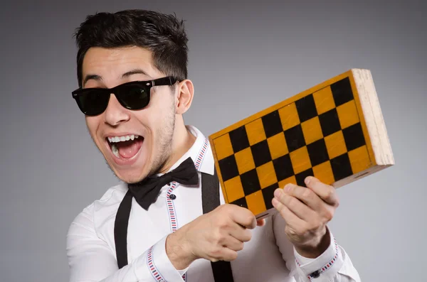 Funny chess player with board — Stock Photo, Image