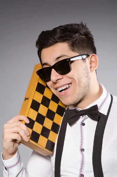 Funny chess player with board — Stock Photo, Image