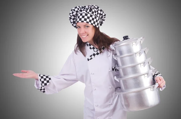 Cook with stack of pots — Stock Photo, Image