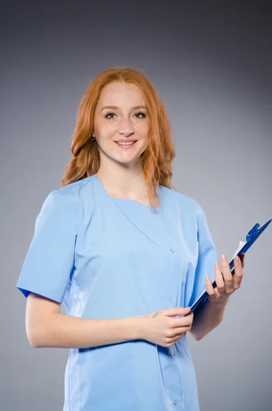 Young woman doctor with book — Stock Photo, Image