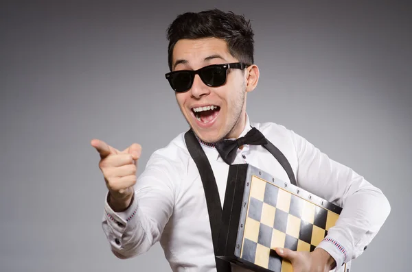 Funny chess player with board — Stock Photo, Image