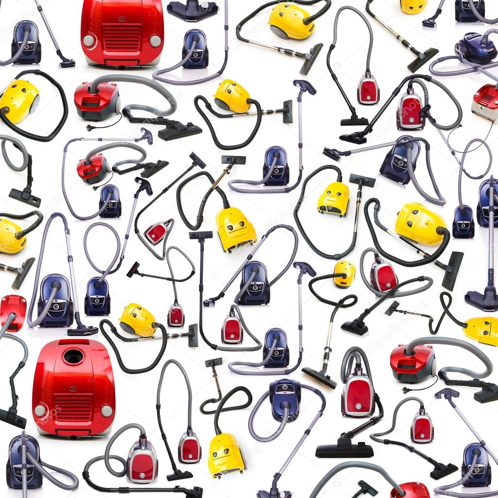 Background made of many vacuum cleaners on white