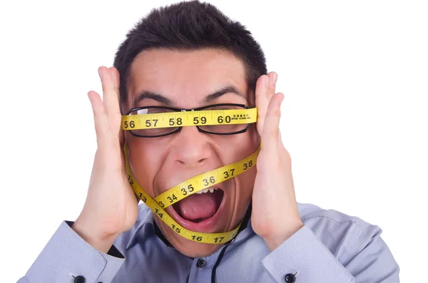 Человек с сантиметром в концепции диеты — стоковое фото