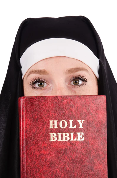 Young nun with bible isolated on white — Stock Photo, Image