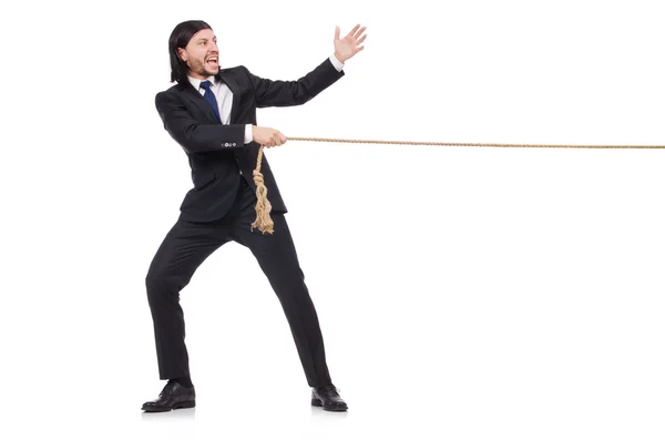 Jovem empresário puxando corda isolada no branco — Fotografia de Stock