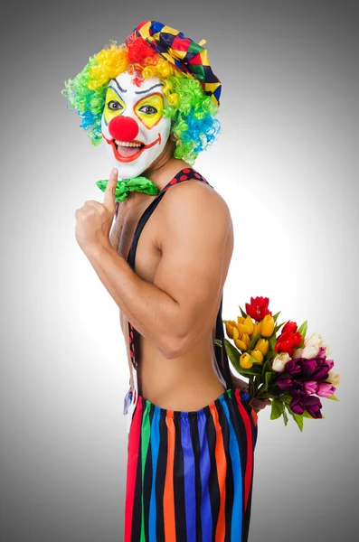 Clown with flowers — Stock Photo, Image