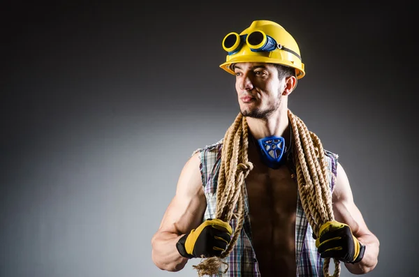 Ripped muscular builder man with tools — Stock Photo, Image