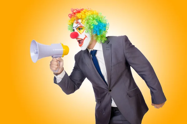 Businessman clown with loudspeaker — Stock Photo, Image