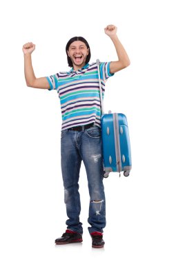 Genç adam beyaz bavullarla seyahat ediyor.