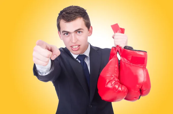 Young businessman with red glovers — Stock Photo, Image