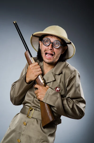 Funny safari hunter with rifle — Stock Photo, Image