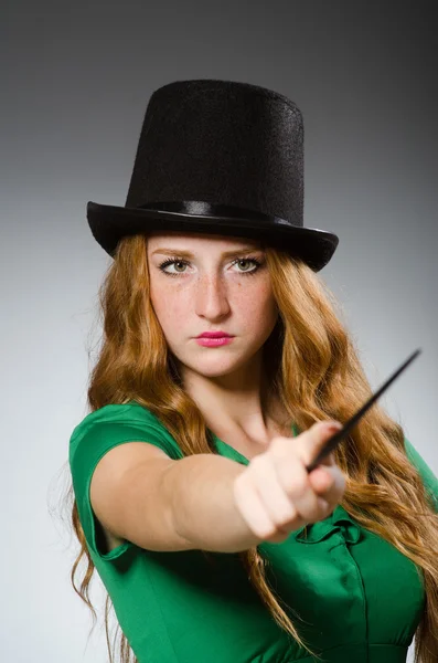 Woman magician wearing green dress — Stock Photo, Image