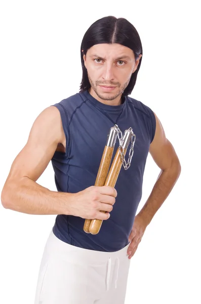 Combattente karate divertente con nunchaku su bianco — Foto Stock