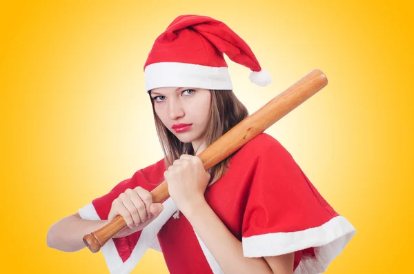 Woman santa with bat — Stock Photo, Image