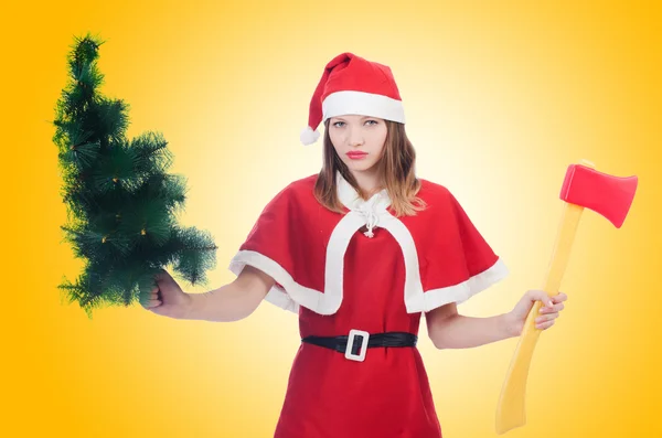 Woman santa with tree and axe — Stock Photo, Image