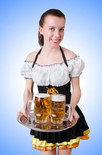 Young waitress with beer — Stock Photo, Image