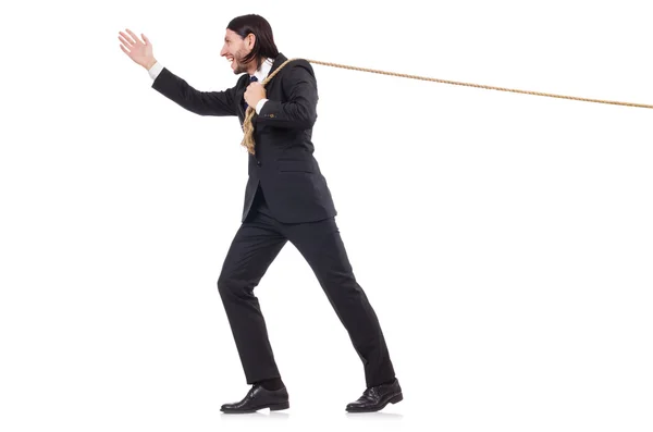 Jonge zakenman trekt touw geïsoleerd op wit — Stockfoto