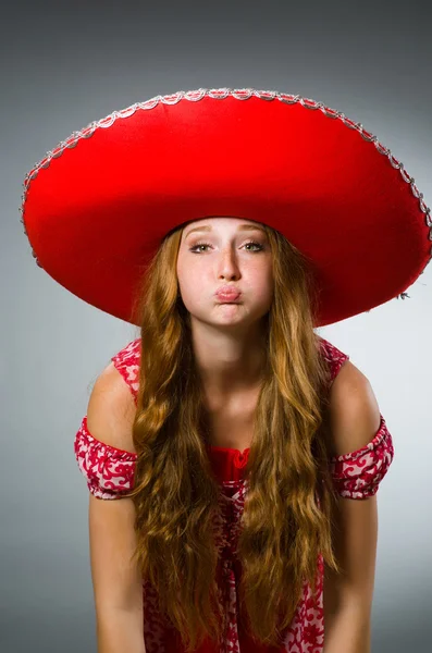 Woman wearing sombrero hat in funny concept — Stock Photo, Image