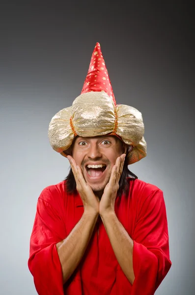 Funny wizard wearing red dress — Stock Photo, Image