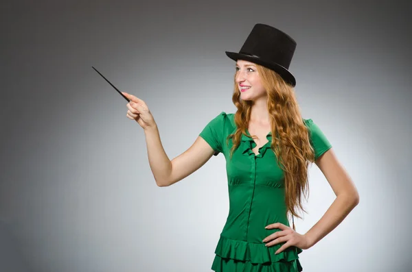 Woman magician wearing green dress — Stock Photo, Image