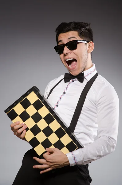 Funny chess player with board — Stock Photo, Image