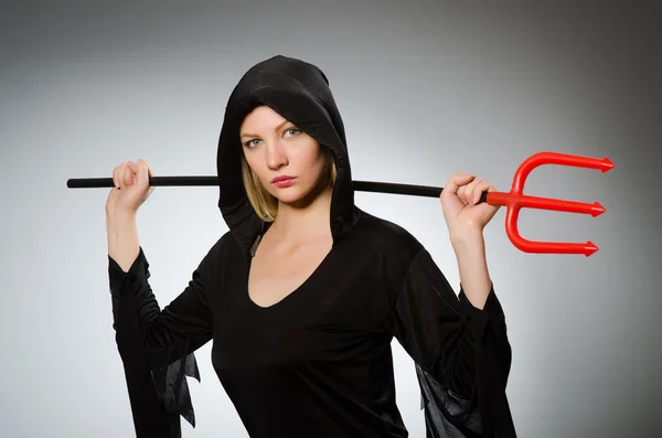 Halloween concept with woman holding pitchfork — Stock Photo, Image