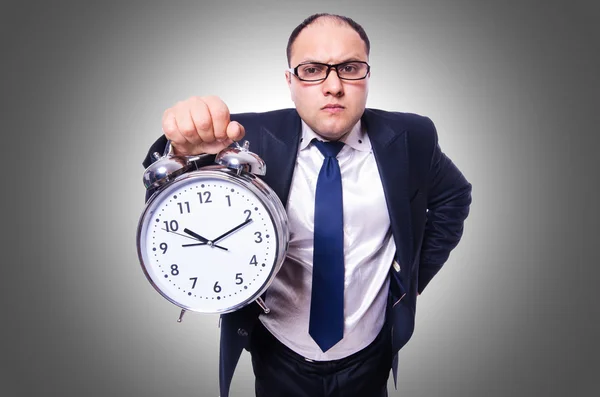 Homme d'affaires avec horloge isolé sur blanc — Photo