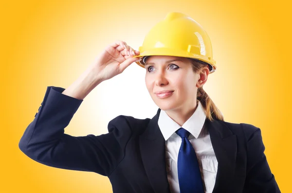 Businesswoman in hard hat Stock Picture