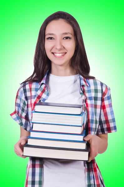 Student tjej med många böcker — Stockfoto