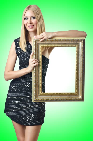 Woman holding picture frame — Stock Photo, Image
