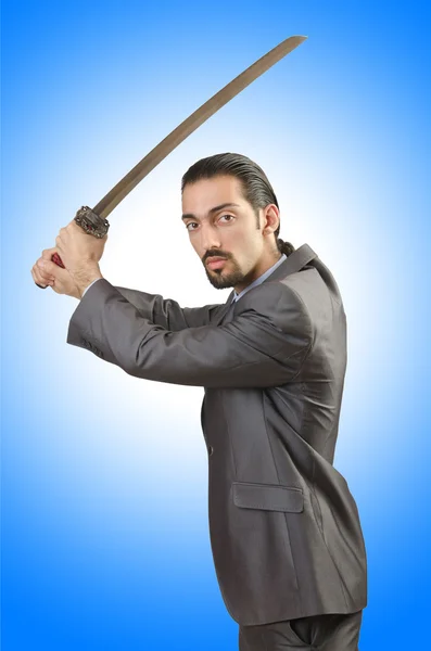 Бизнесмен с мечом — стоковое фото