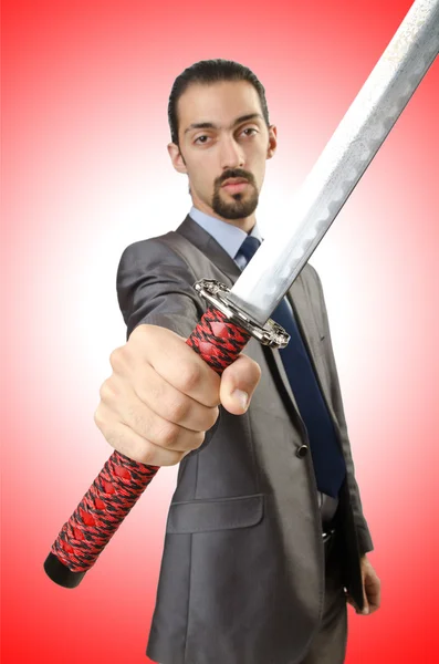 Businessman with sword — Stock Photo, Image