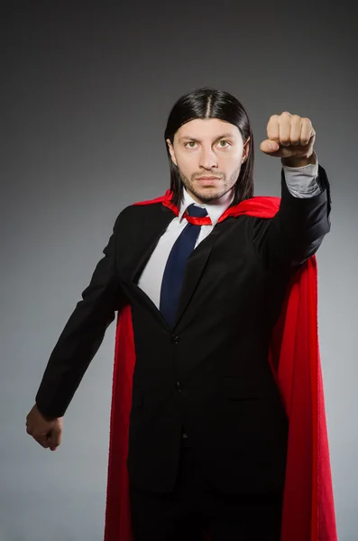 Superman concept with man in red cover — Stock Photo, Image