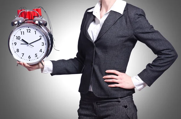 Woman with dynamite and clock on white — Stock Photo, Image