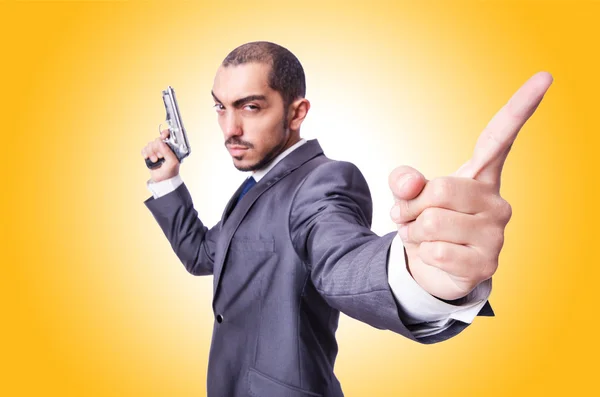 Businessman with gun — Stock Photo, Image