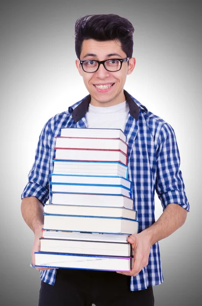 Estudante com muitos livros — Fotografia de Stock