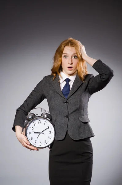 Businesswoman with clock — Stock Photo, Image