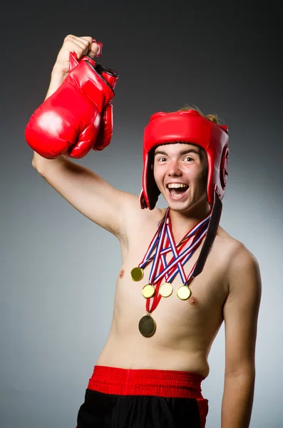 Funny boxer with winning gold medal — Stock Photo, Image