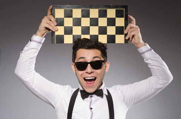 Funny chess player with board — Stock Photo, Image