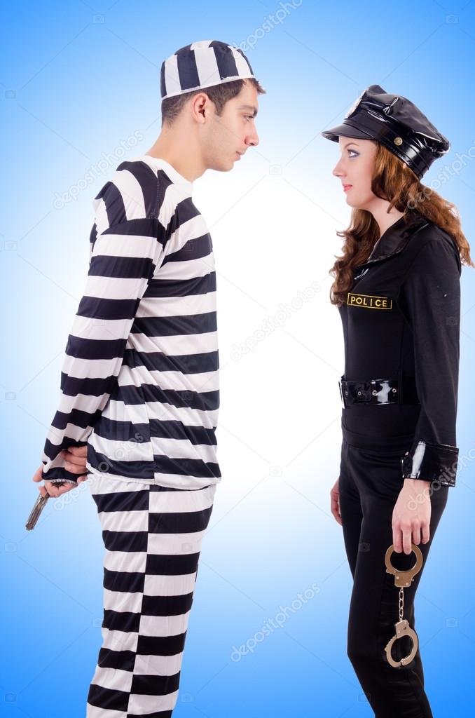 Police lady and prison inmate against the gradient